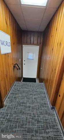 a view of living room with furniture and a window