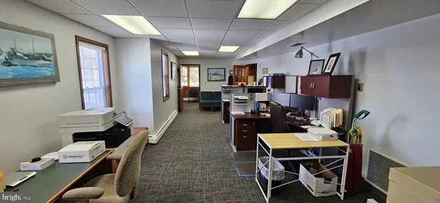 a room with wooden floor and furniture