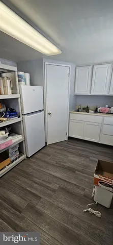 a view of living room with furniture and a window