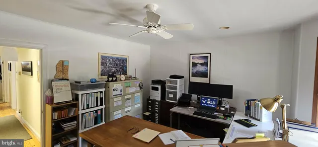 a workspace with furniture and window