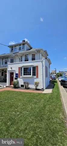a view of a house with backyard porch and sitting area