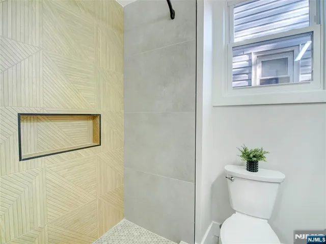 a bathroom with a toilet and a sink