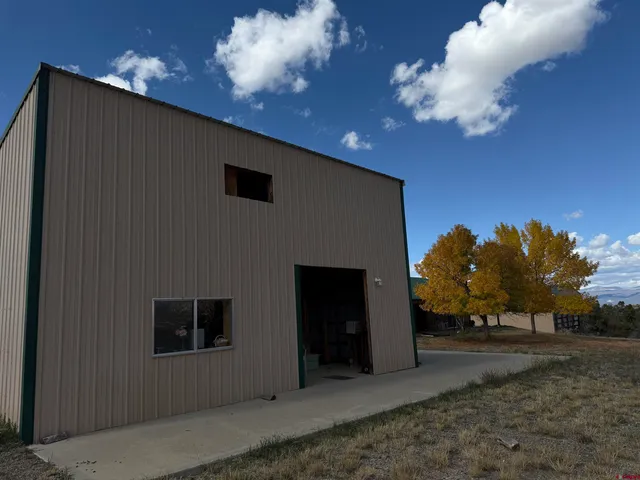 a view of a big yard with an trees