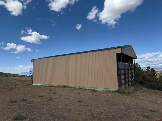 a view of a porch with a table and a fire pit