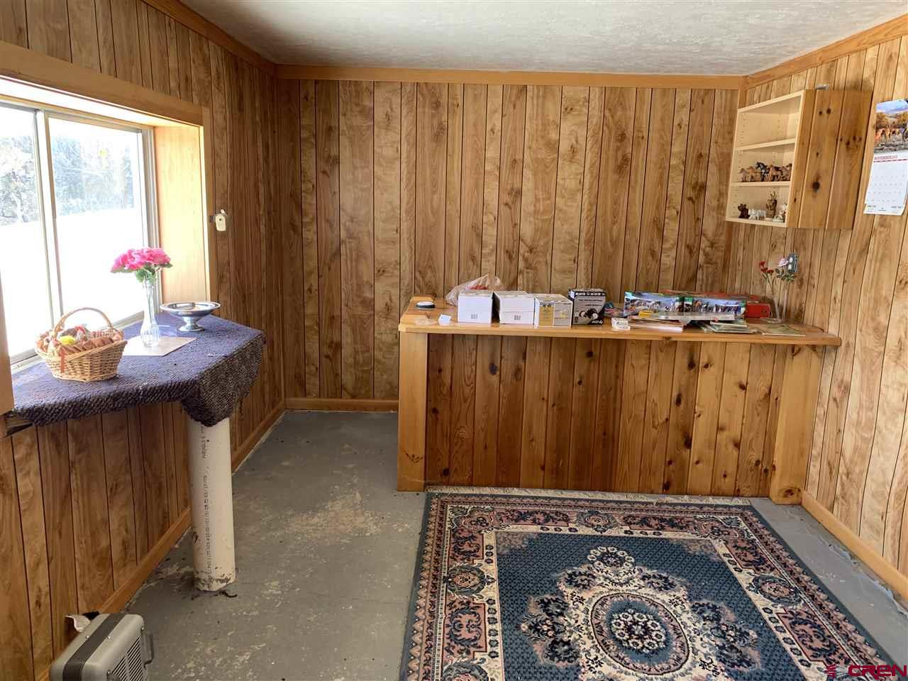 38832 Fruitland Mesa Road Crawford, CO 81415 - Photo 29 of 41 a view of a room with furniture and window