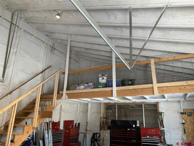 a view of a room with furniture and window