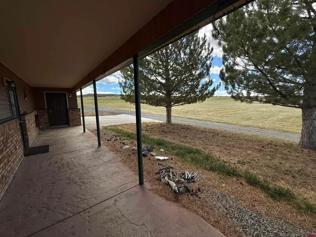 a view of a backyard of the house