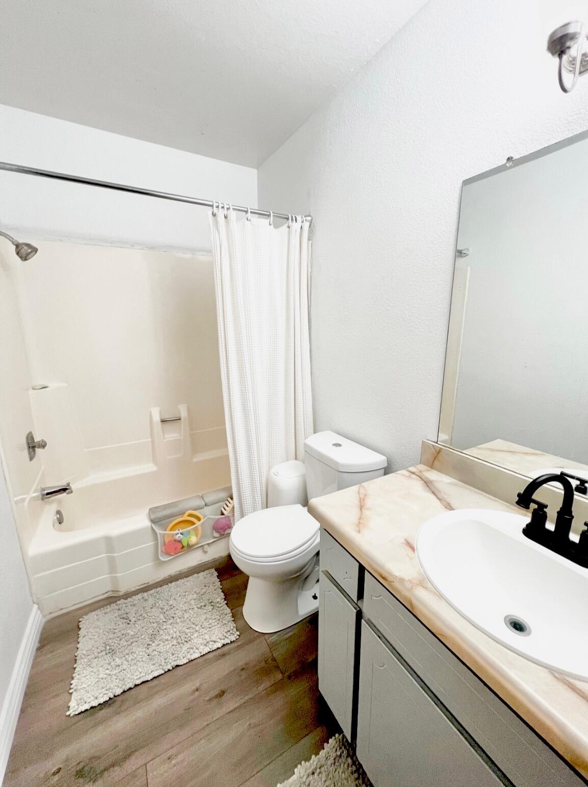 511 D Street Upland, CA 91786 - Photo 7 of 8 a bathroom with a sink toilet and shower