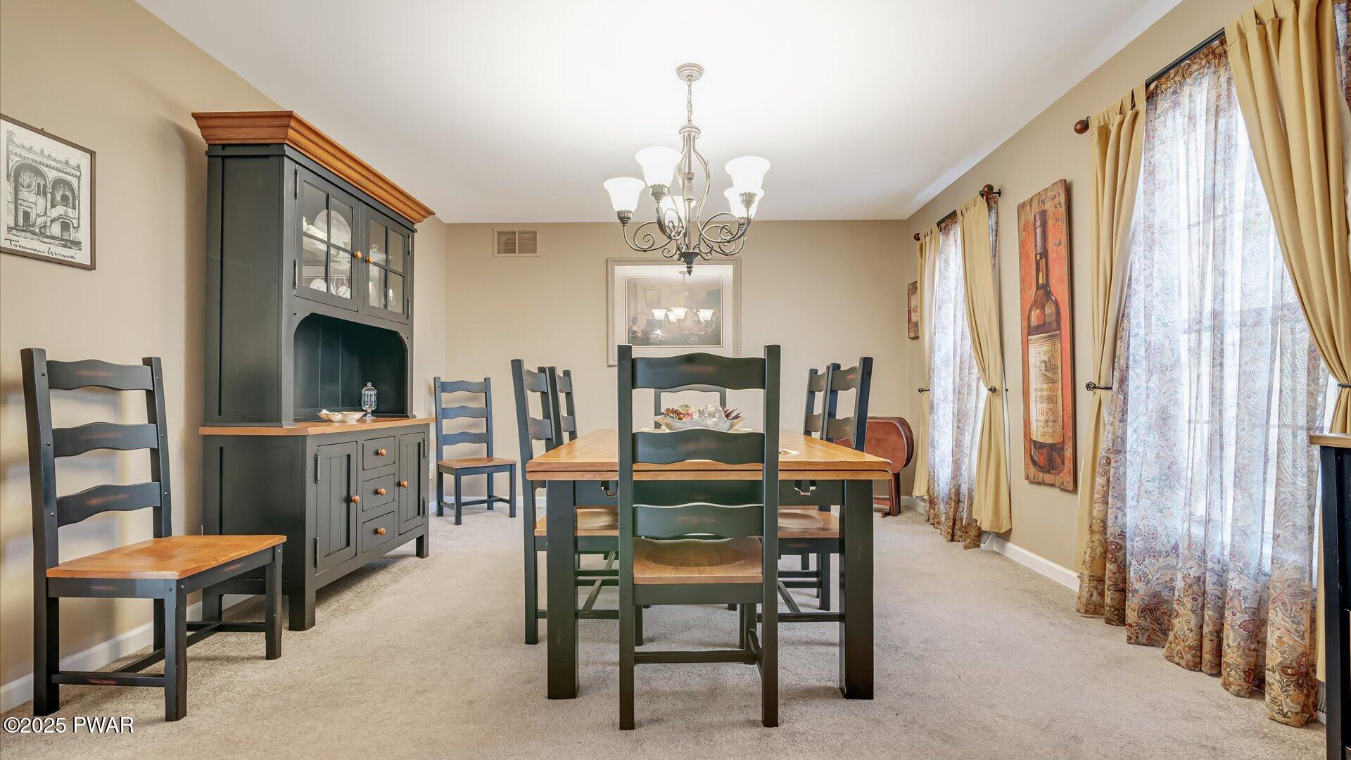 66 Boulder Road Lake Ariel, PA 18436 - Photo 9 of 51 a view of a dining room with furniture and a chandelier