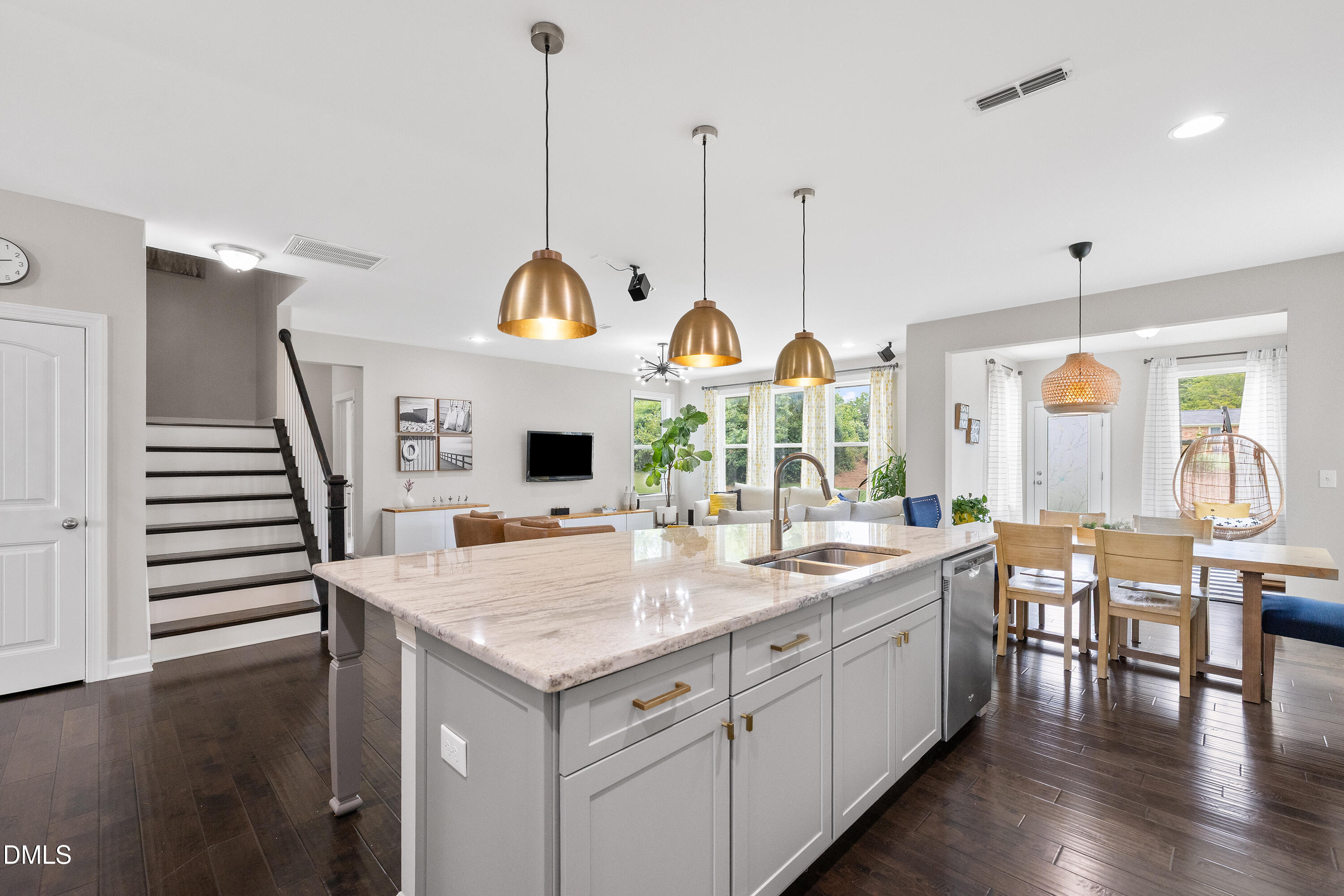 8059 Gilano Drive Raleigh, NC 27603 - Photo 19 of 43 a kitchen with sink and wooden floor