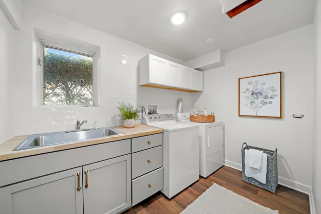a spacious bathroom with a double vanity sink and a mirror