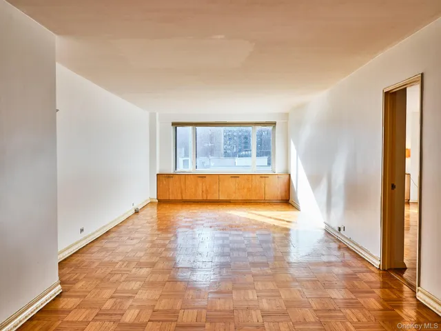 a view of a room with a tub and a window