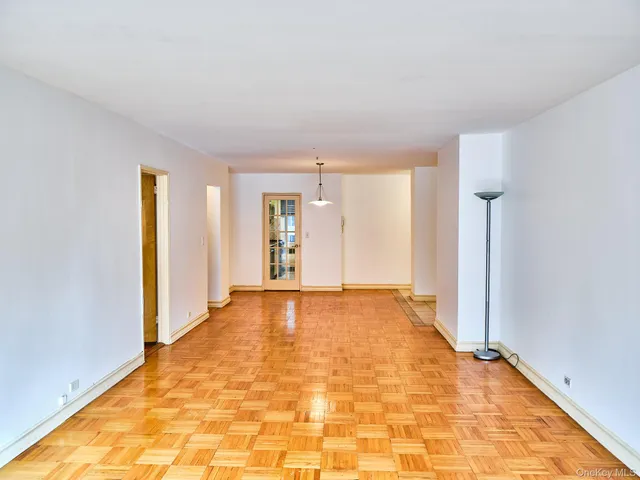 a view of an empty room with windows