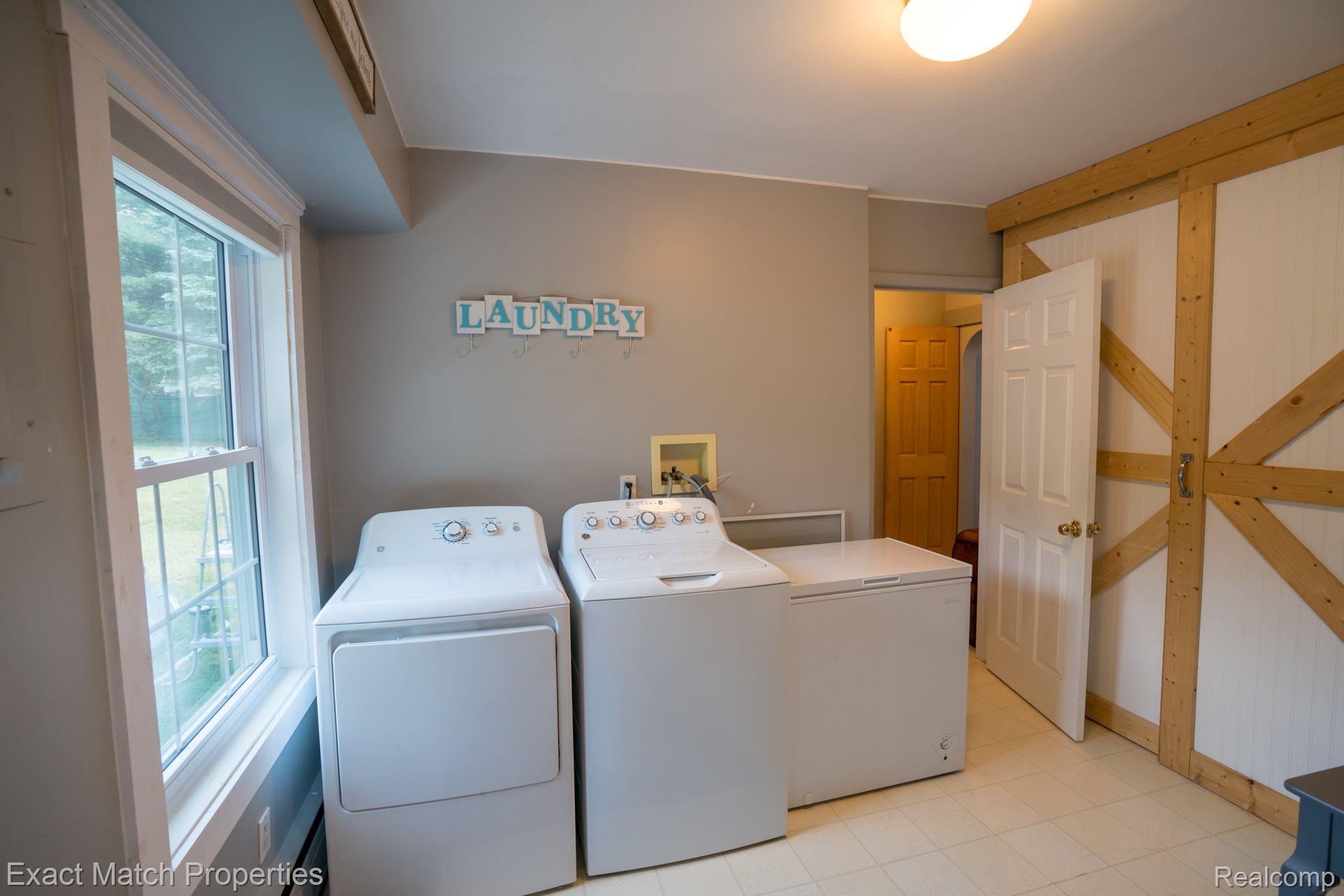 3916 Gregory Road Lake Orion, MI 48359 - Photo 15 of 36 Laundry/Mud Room With Barn Door to Large Pantry...