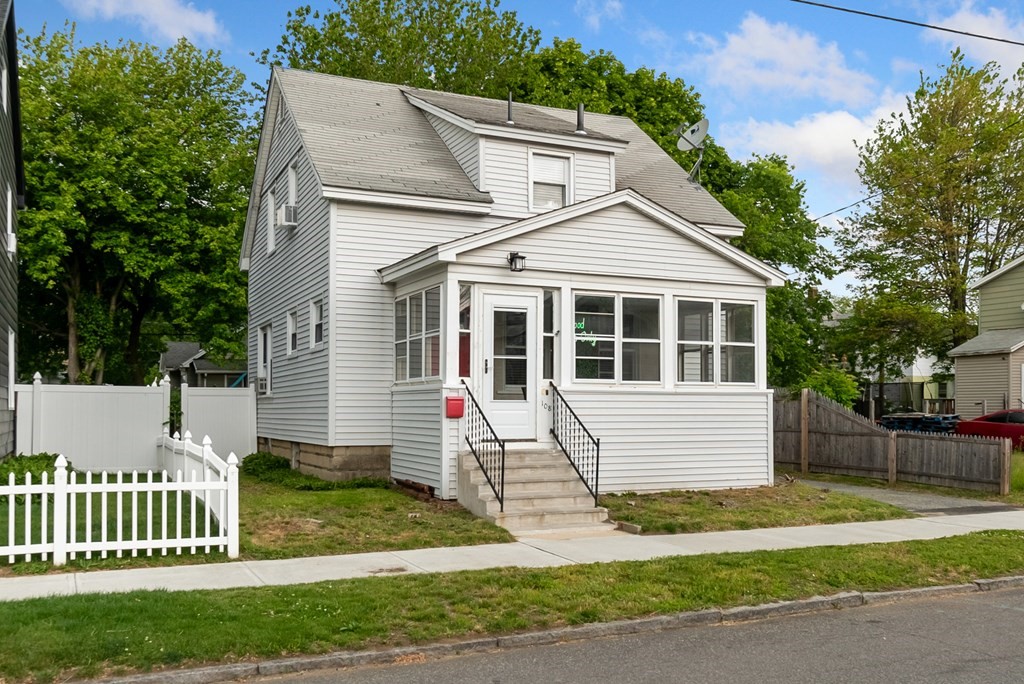 108 Wilber Street Springfield, MA 01104 - Photo 3 of 32 a view of a white house with a yard and large trees