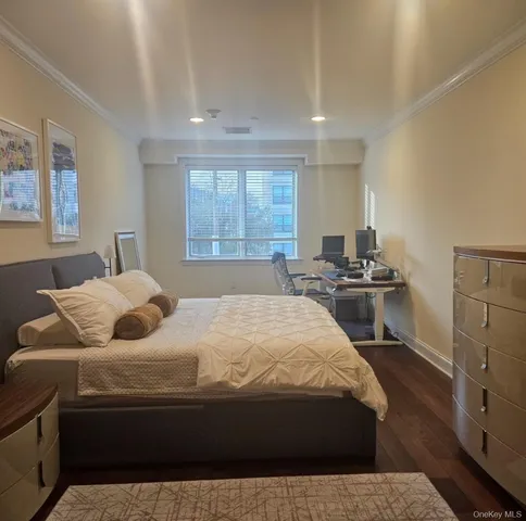 a bedroom with a bed and dresser