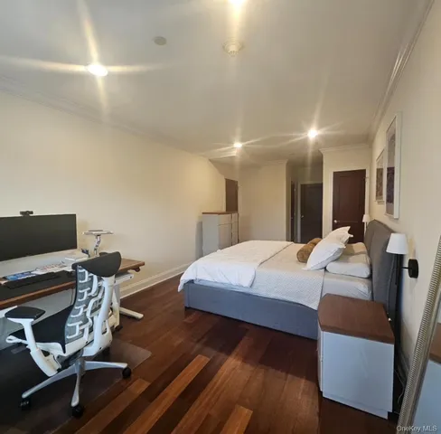 a bed room with a bed and a computer