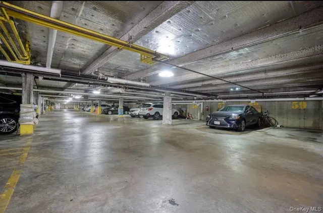 a view of parking garage with cars
