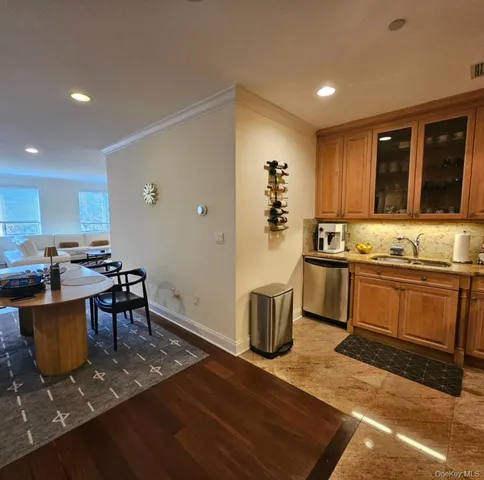 a kitchen with stainless steel appliances granite countertop a stove and a refrigerator