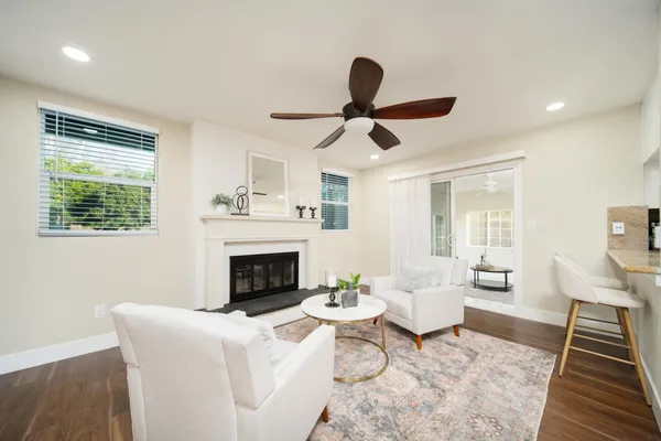 a living room with furniture and a fireplace