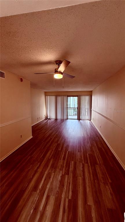 6519 West Newberry Road, Unit 206 Gainesville, FL 32605 - Photo 3 of 14 a view of livingroom with hardwood and floor to ceiling window