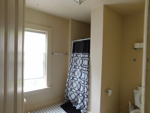512 North 9th Street Rochelle, IL 61068 - Photo 14 of 14 a bathroom with a window and a shower