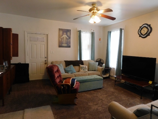 512 North 9th Street Rochelle, IL 61068 - Photo 3 of 14 a living room with furniture and a flat screen tv