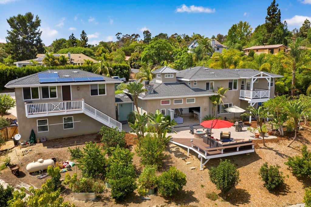 a aerial view of a house with swimming pool garden and patio