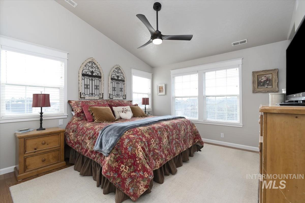 14111 Towers Drive Caldwell, ID 83607 - Photo 21 of 50 Bedroom featuring lofted ceiling, ceiling fan, and light carpet