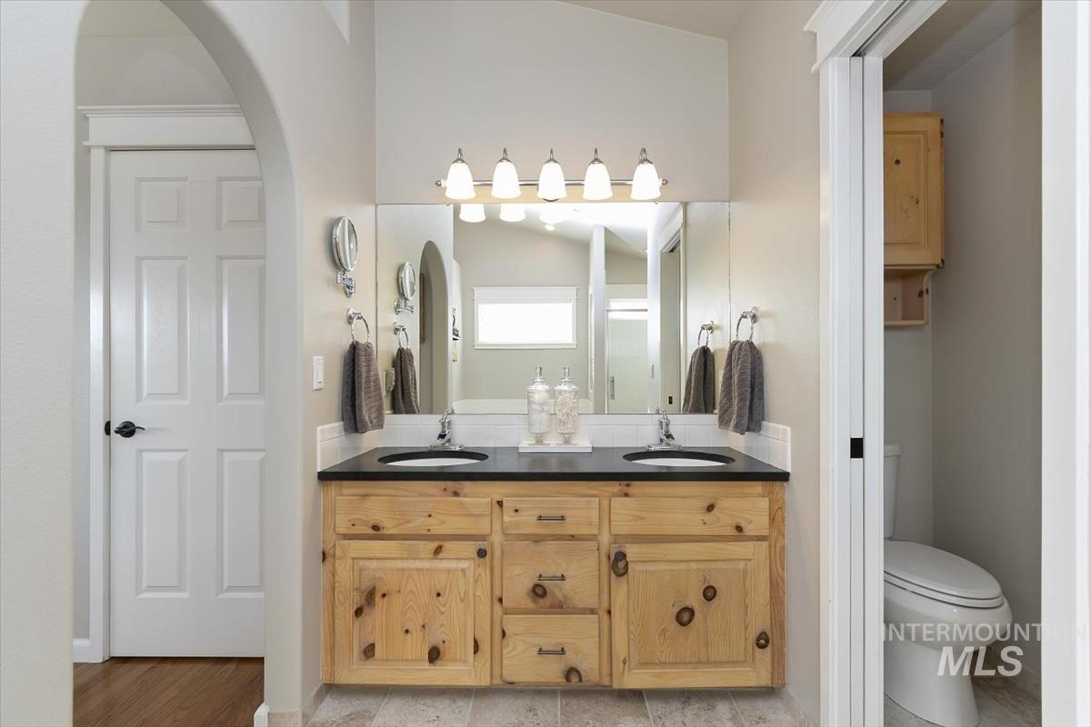 14111 Towers Drive Caldwell, ID 83607 - Photo 24 of 50 Bathroom with double vanity and a shower stall