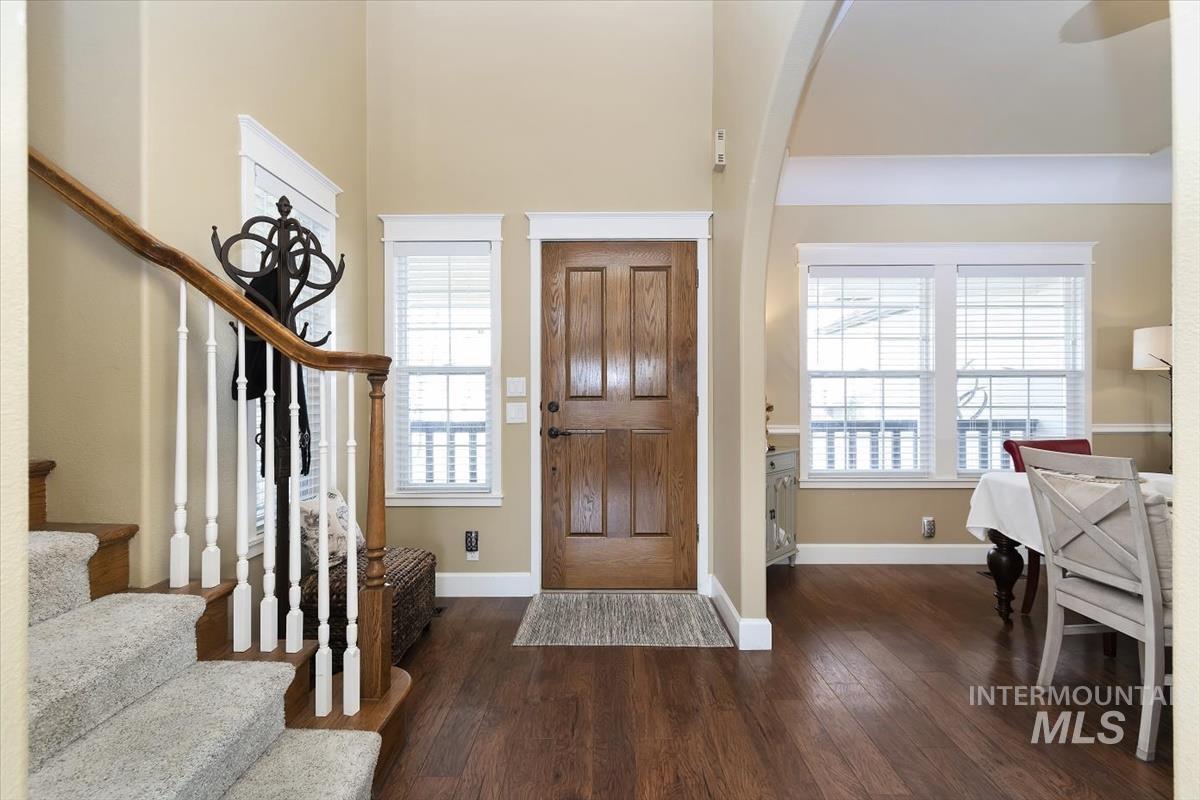 14111 Towers Drive Caldwell, ID 83607 - Photo 3 of 50 Entrance foyer featuring dark wood-style flooring and stairway