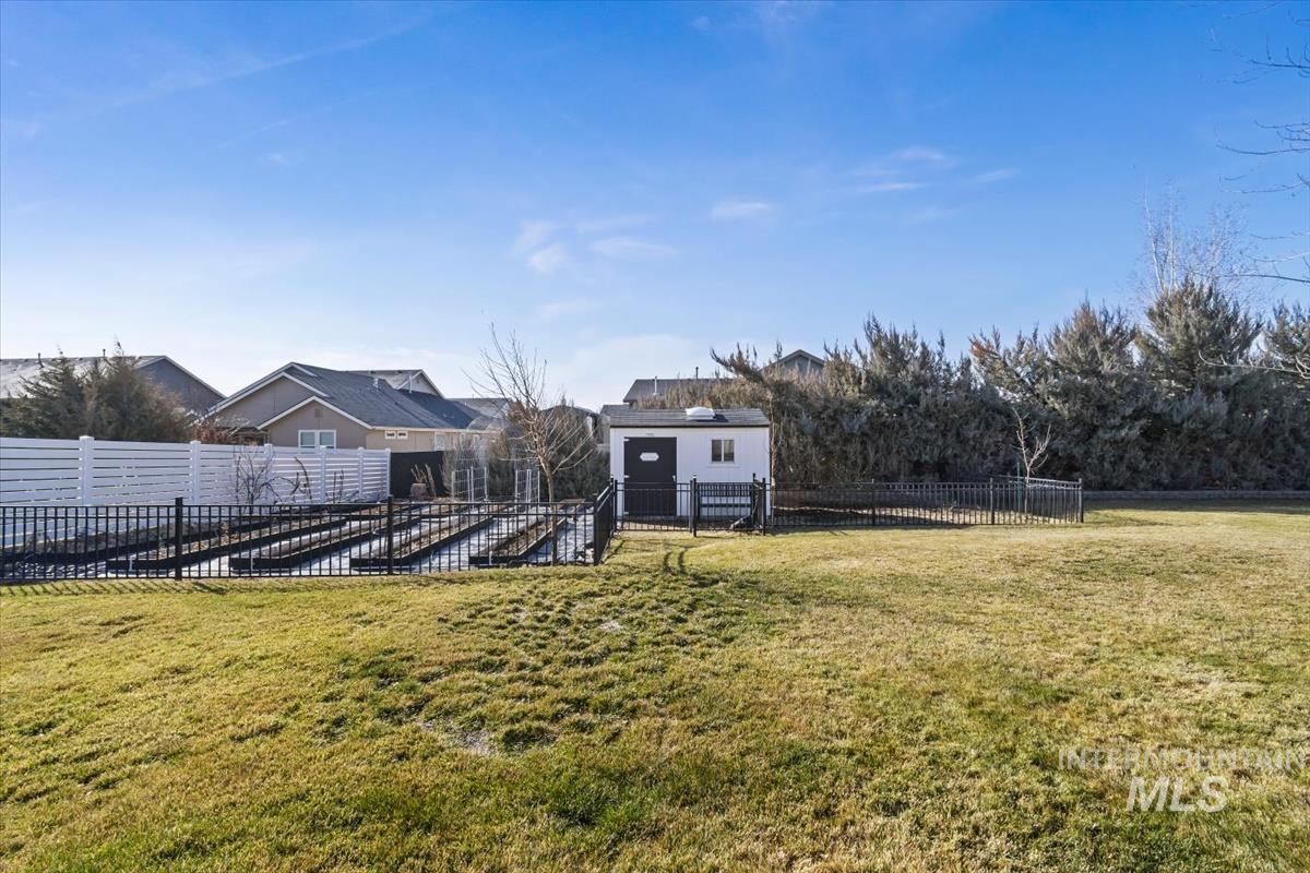 14111 Towers Drive Caldwell, ID 83607 - Photo 35 of 50 Fenced garden with an outbuilding