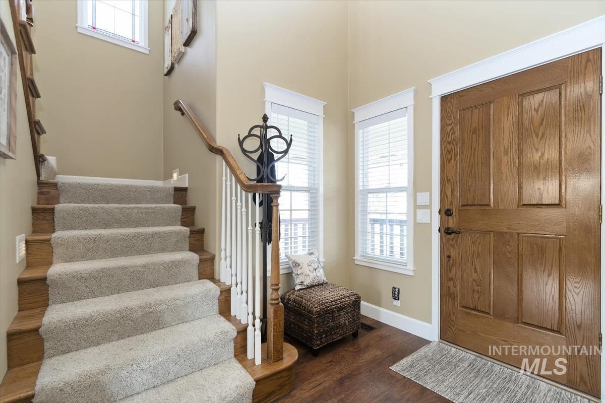 14111 Towers Drive Caldwell, ID 83607 - Photo 4 of 50 Foyer featuring dark wood-type flooring, a high ceiling, and stairs