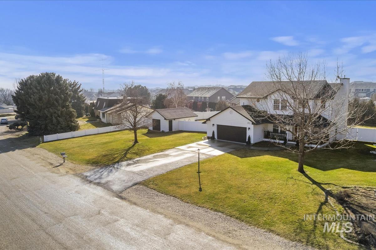 14111 Towers Drive Caldwell, ID 83607 - Photo 44 of 50 View of front facade with concrete driveway, a residential view, and a garage