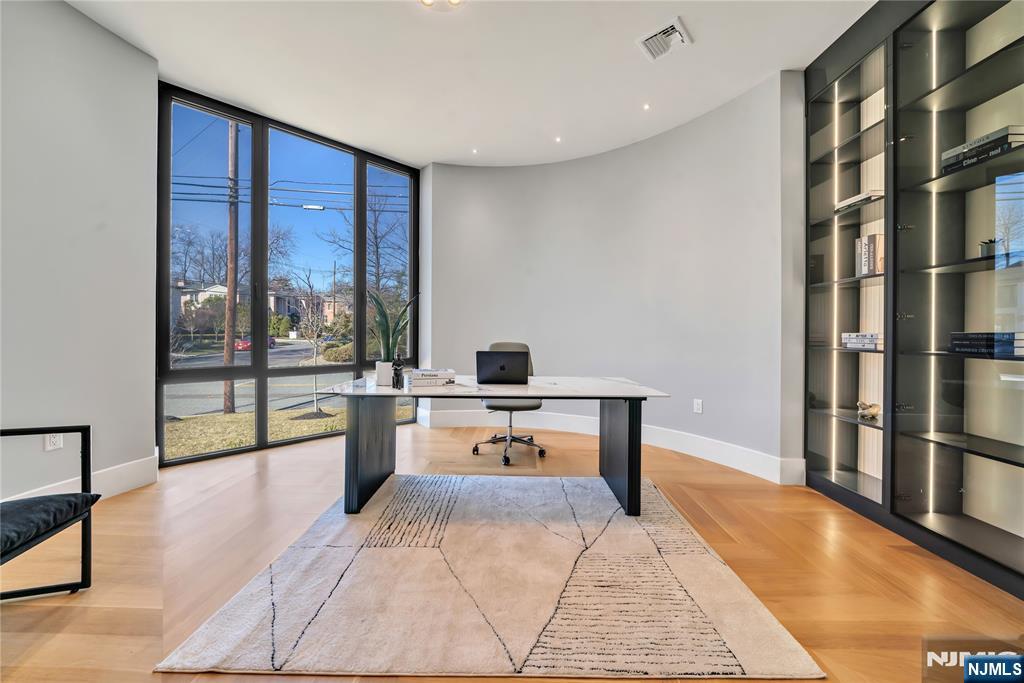 11 Roberts Road Englewood Cliffs, NJ 07632 - Photo 23 of 50 a bedroom with a large bed and a view of living room
