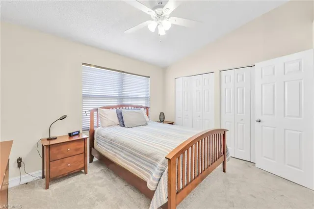 a utility room with fridge dryer and washer