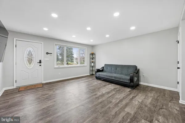a living room with furniture and window