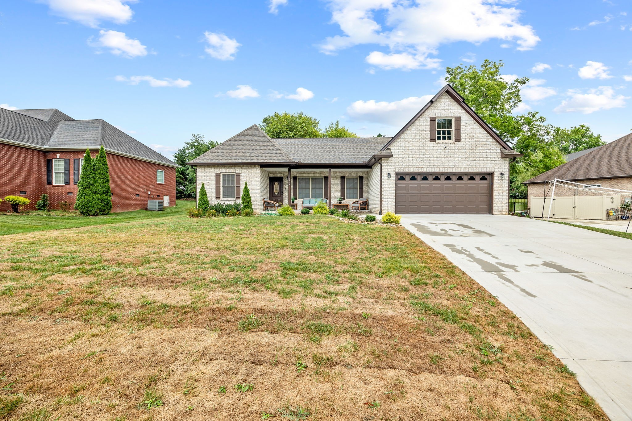 1309 Bridle Path Cookeville, TN 38501 - Photo 1 of 32 a front view of a house with a garden