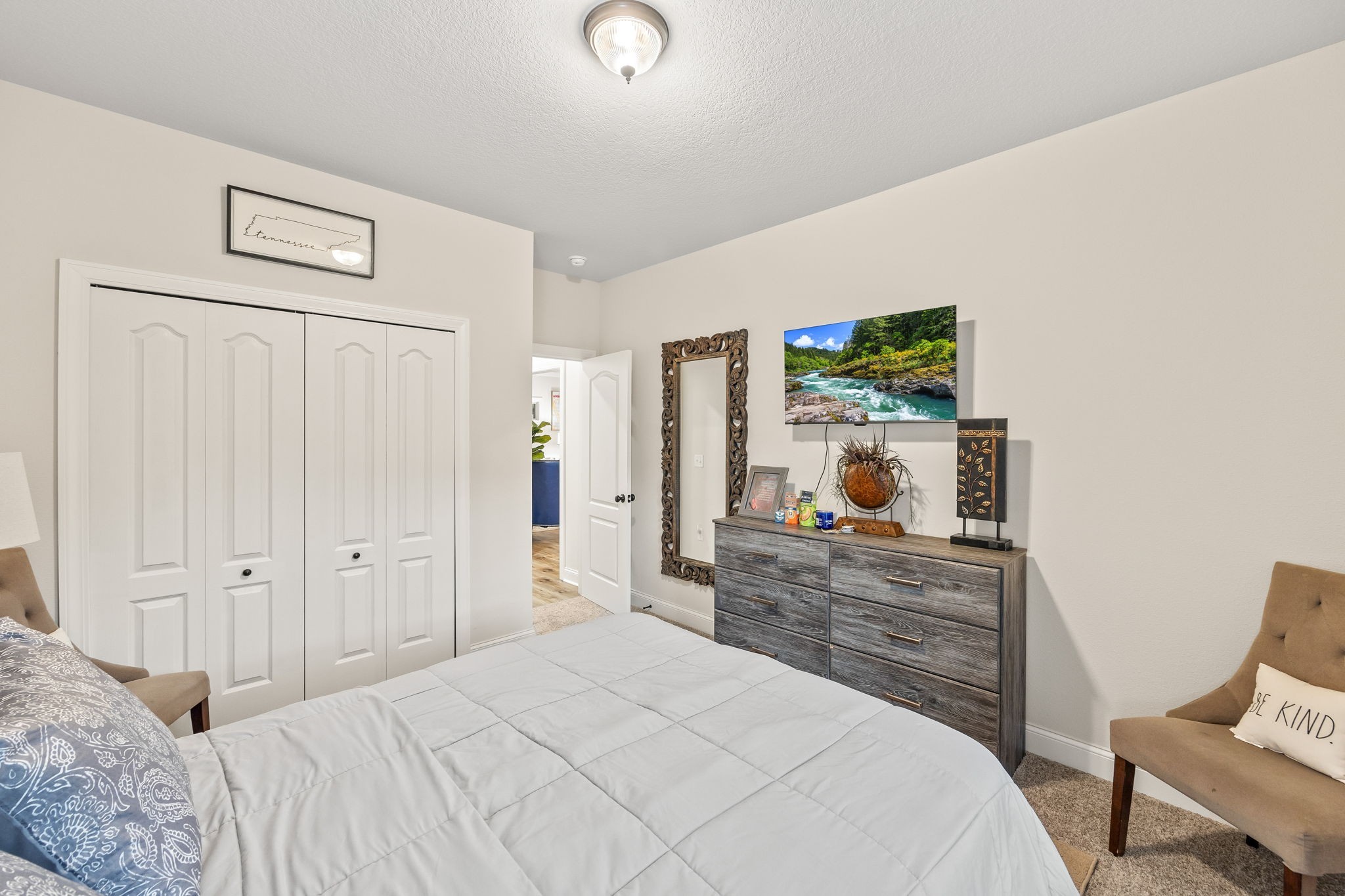 1309 Bridle Path Cookeville, TN 38501 - Photo 15 of 32 a bedroom with a bed and a flat screen tv