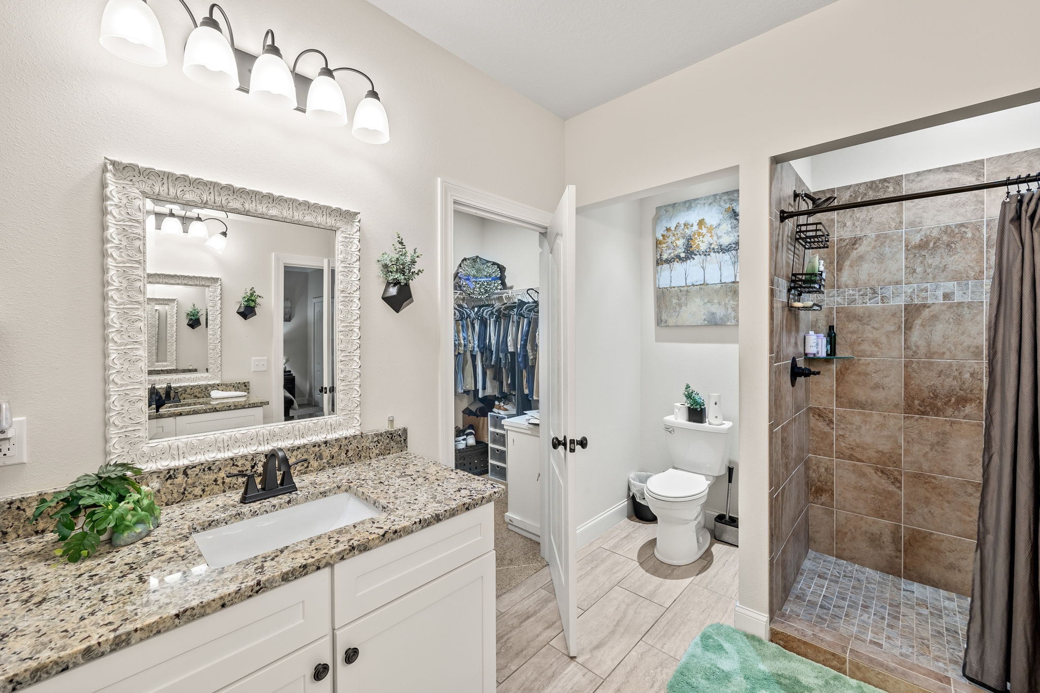 1309 Bridle Path Cookeville, TN 38501 - Photo 18 of 32 a bathroom with a granite countertop sink a toilet and shower