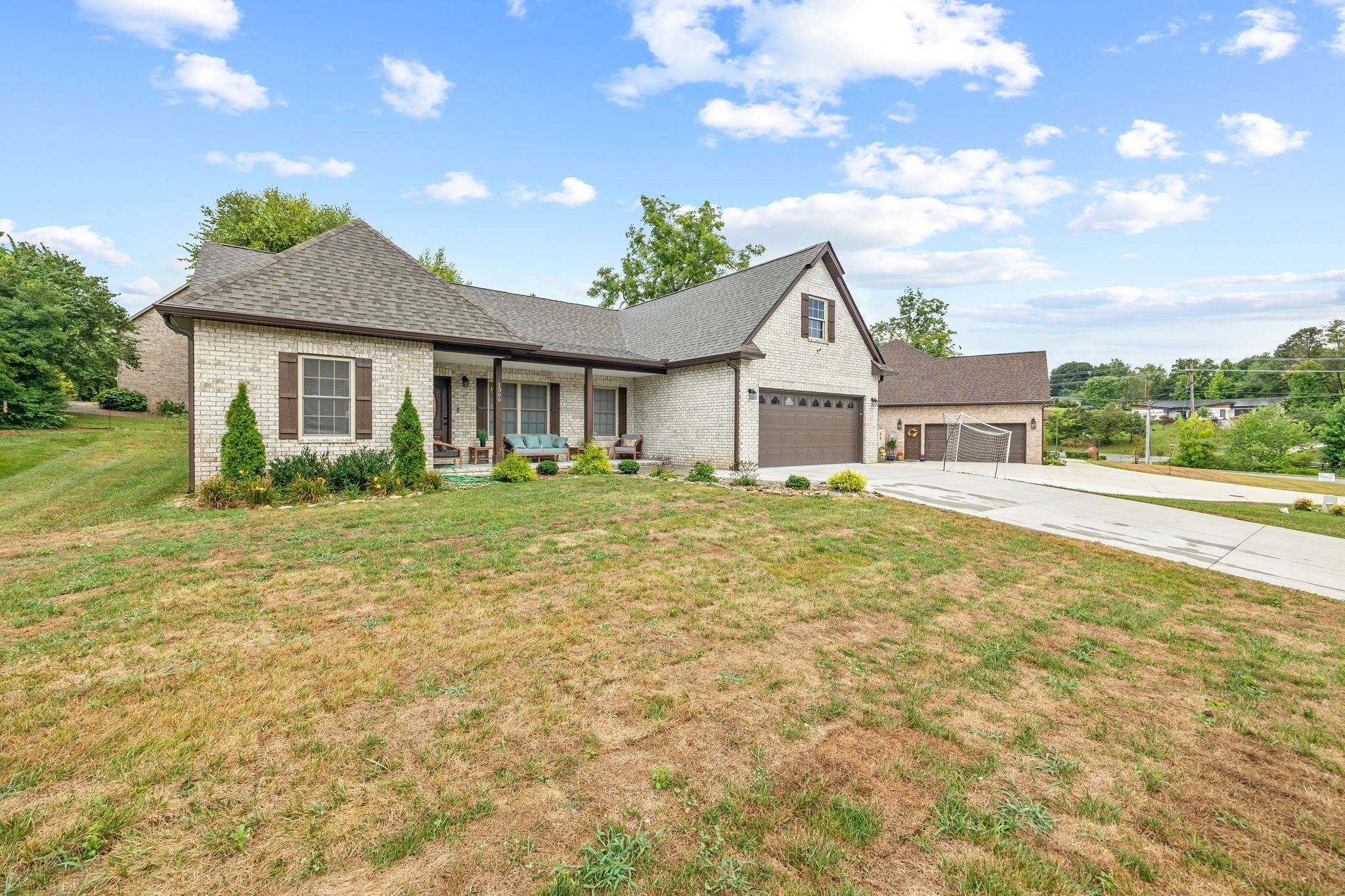 1309 Bridle Path Cookeville, TN 38501 - Photo 2 of 32 a front view of house with yard and green space