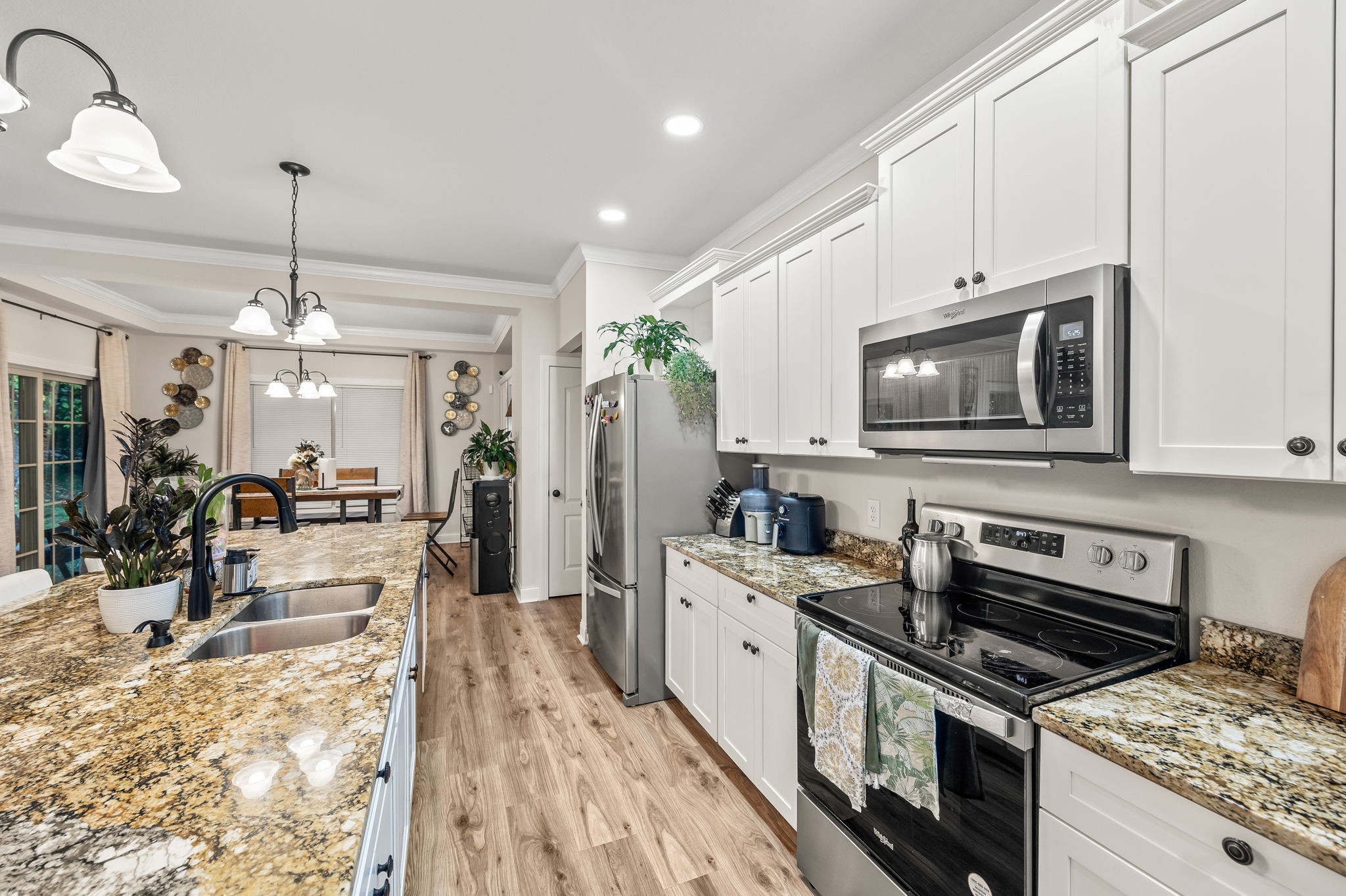 1309 Bridle Path Cookeville, TN 38501 - Photo 7 of 32 a kitchen with a stove a sink and a microwave