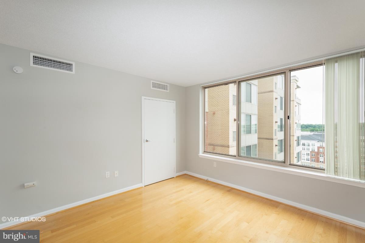 2726 Gallows Road, Unit 1202 Vienna, VA 22180 - Photo 13 of 24 a view of an empty room with a window