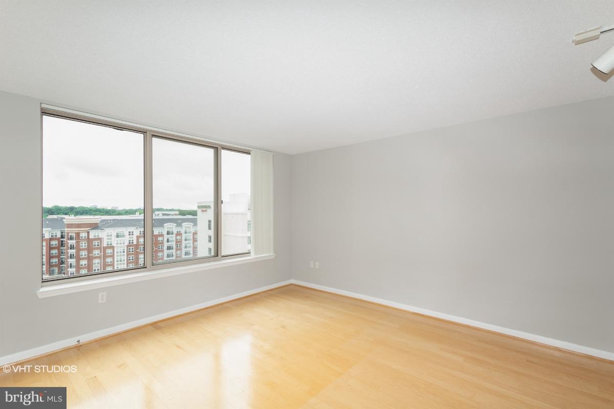 2726 Gallows Road, Unit 1202 Vienna, VA 22180 - Photo 14 of 24 an empty room with a window