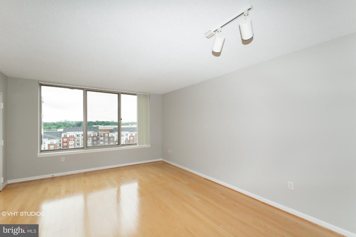 2726 Gallows Road, Unit 1202 Vienna, VA 22180 - Photo 17 of 24 a view of an empty room with a window