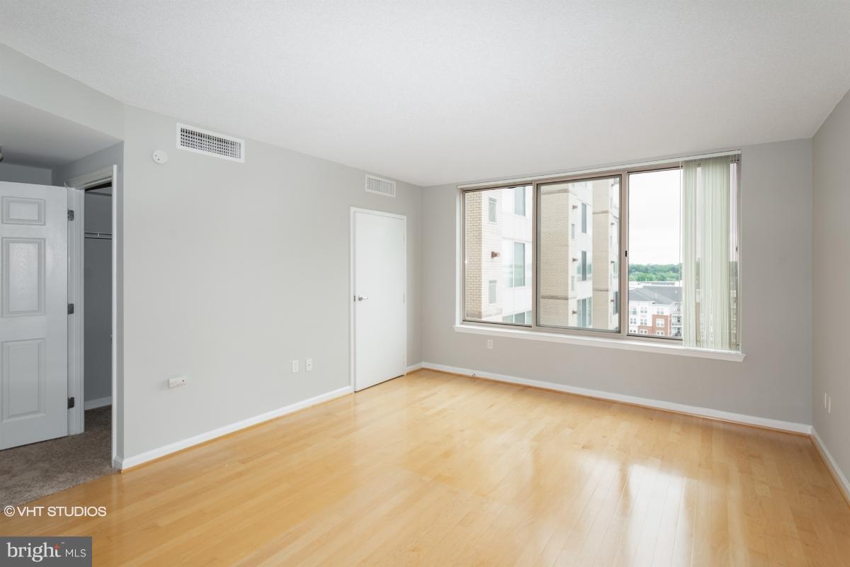 2726 Gallows Road, Unit 1202 Vienna, VA 22180 - Photo 18 of 24 a view of an empty room with a window