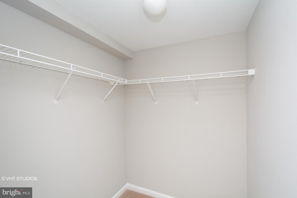 2726 Gallows Road, Unit 1202 Vienna, VA 22180 - Photo 19 of 24 a view of a room with racks on the wall