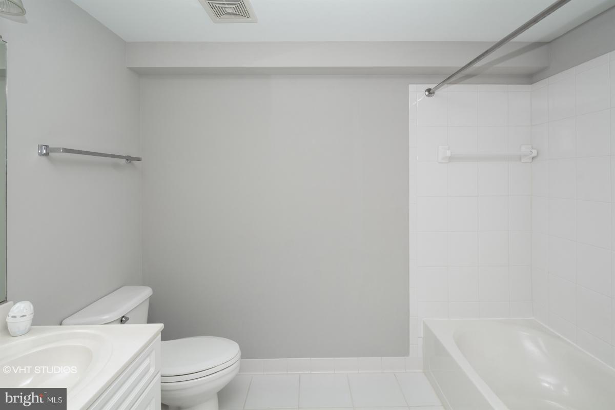 2726 Gallows Road, Unit 1202 Vienna, VA 22180 - Photo 24 of 24 a white toilet sitting next to a bath tub