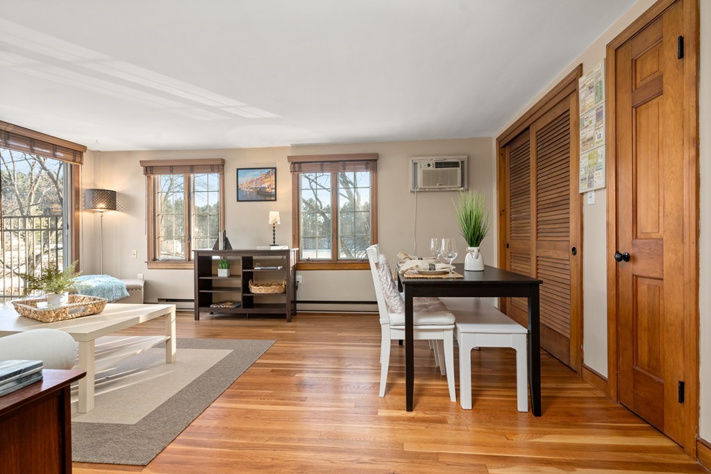 557 Dutton Road, Unit 5 Sudbury, MA 01776 - Photo 8 of 18 a living room with furniture and large windows