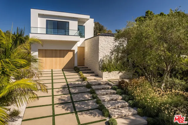 a view of a backyard of the house